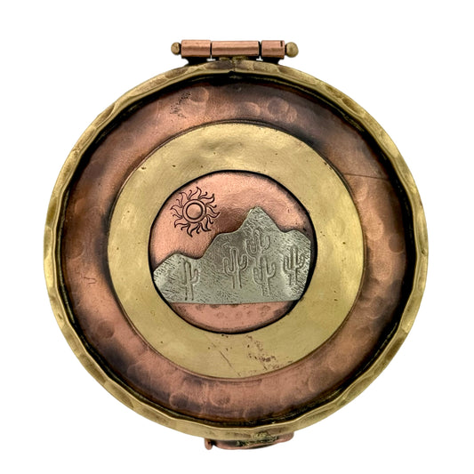 Handmade copper, brass, and silver keepsake box with desert mountain scene, sun, and saguaro cactus design