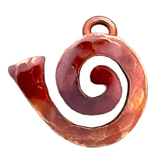 Left-facing copper and brass spiral charm with three soldered ball accents