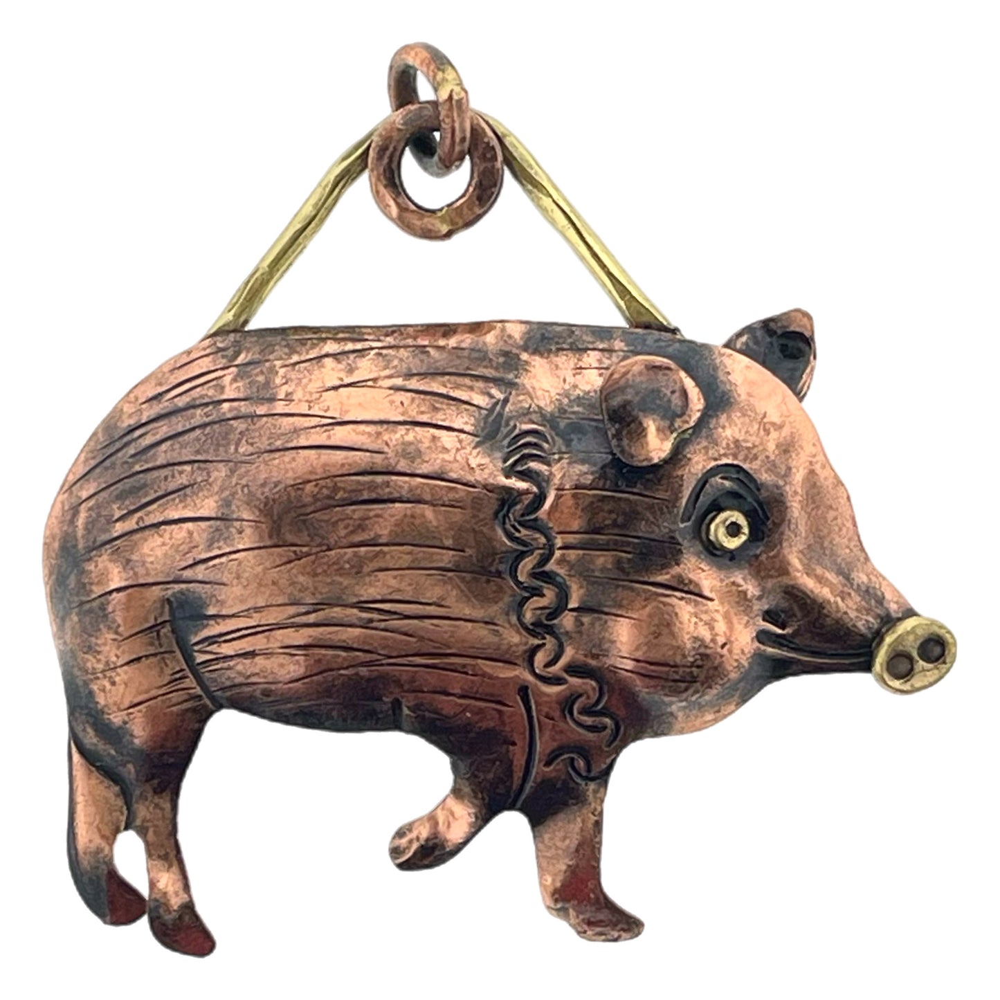 Antiqued copper javelina pendant with brass accents, hand-stamped details, on necklace