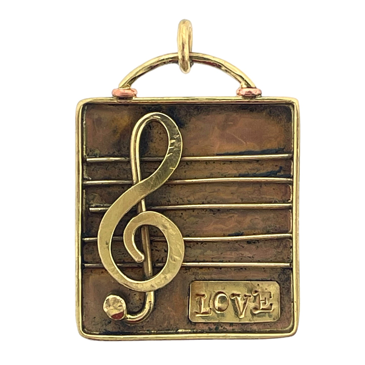 Antiqued copper and brass treble clef pendant with love stamp on hammered copper, handcrafted by Patricia Healey