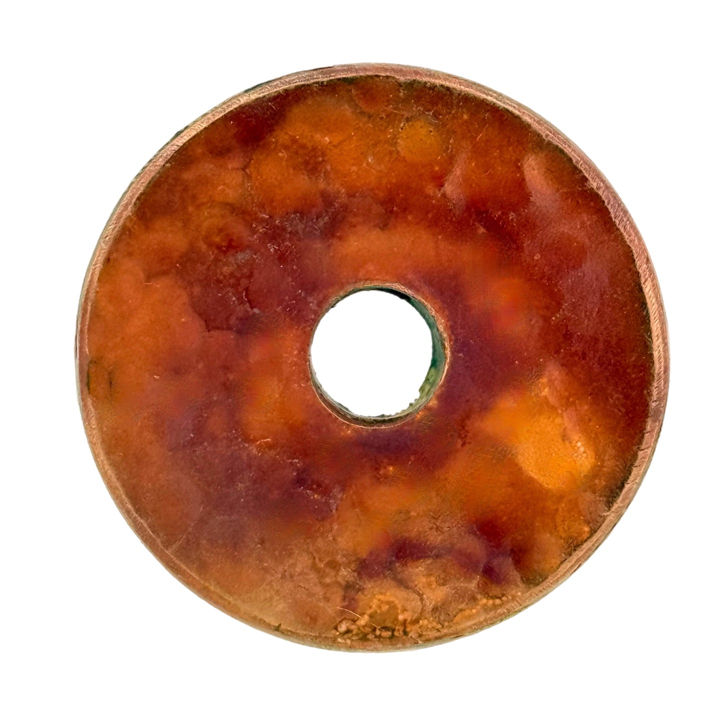 Hammered copper doughnut pendant with vibrant red patina