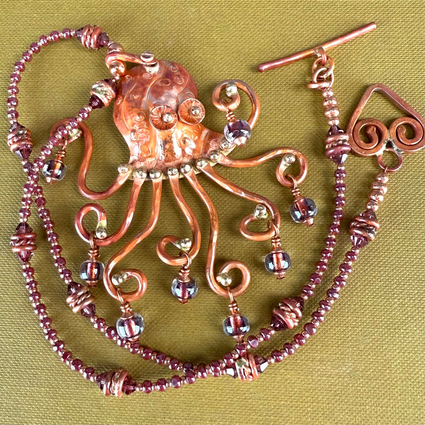 Octopus Necklace in Flame-Finished Copper with Purple Dichroic Beads