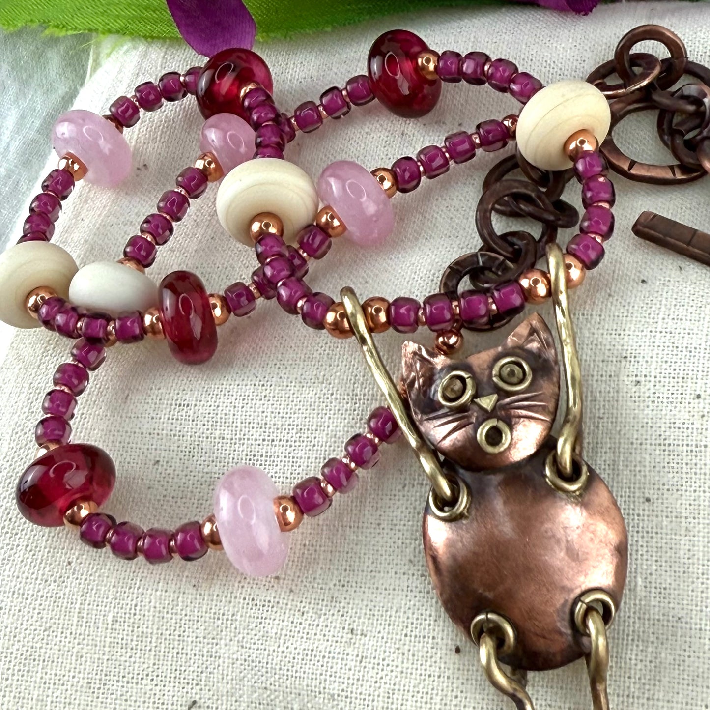 Whimsical Copper Cat Necklace with Artisan Glass