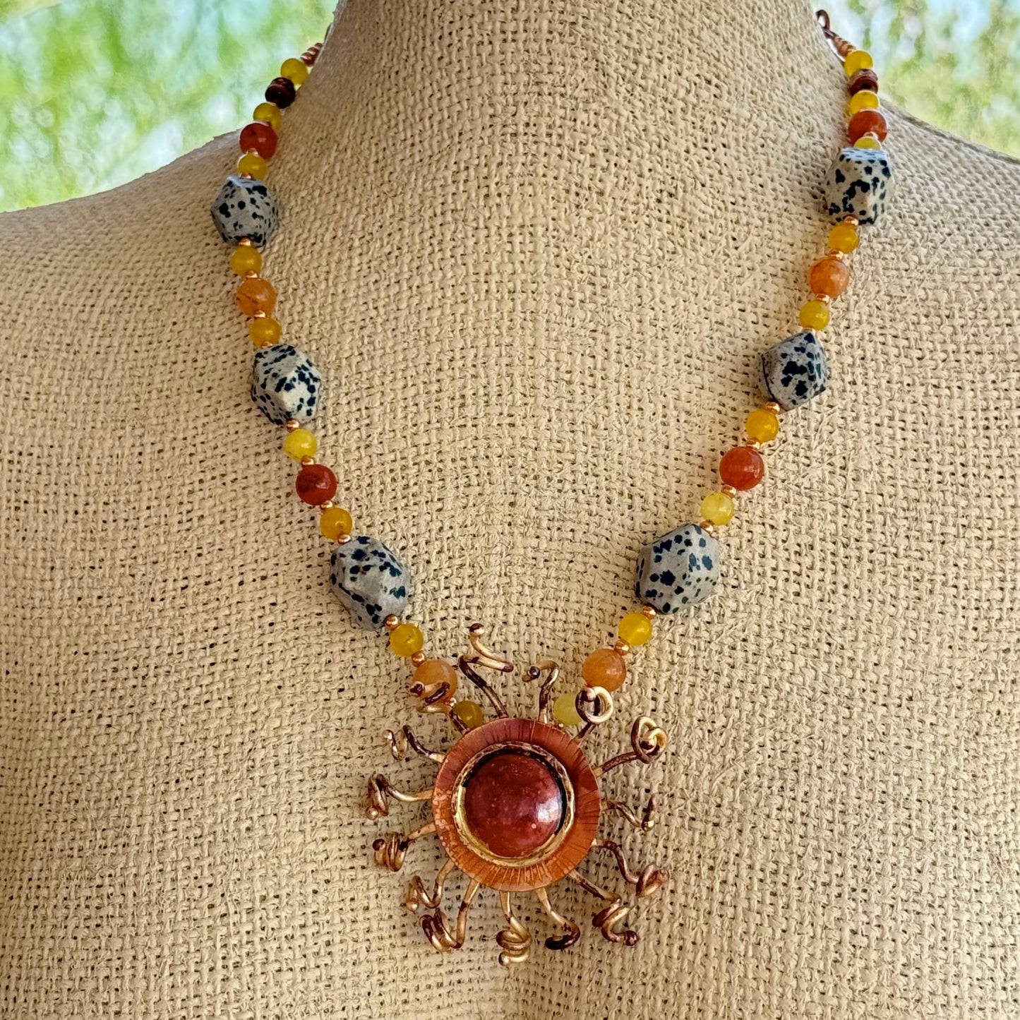 handcrafted copper and brass sunburst necklace with yellow jade, carnelian, and Dalmatian jasper stones
