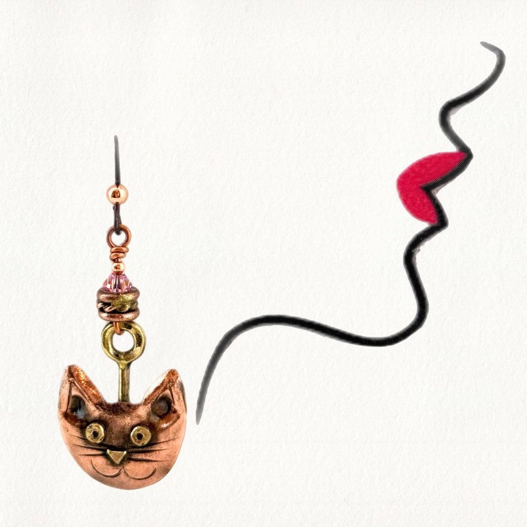 Handmade copper cat face earrings with brass accents, Swarovski crystal beads, and niobium ear wires by Patricia Healey Copper
