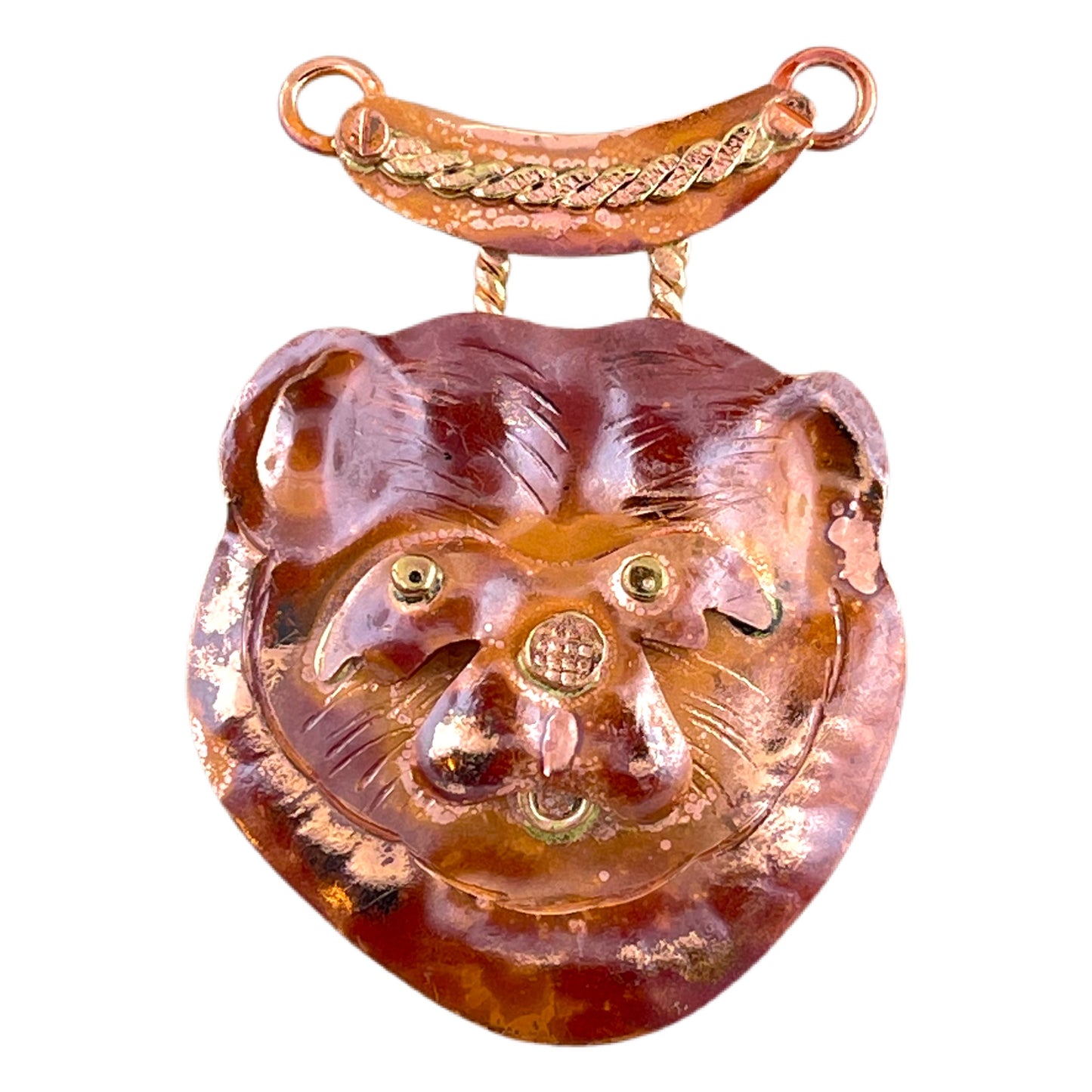 Handcrafted copper bear pendant with red patina and brass accents, designed by Patricia Healey for nature-inspired jewelry making