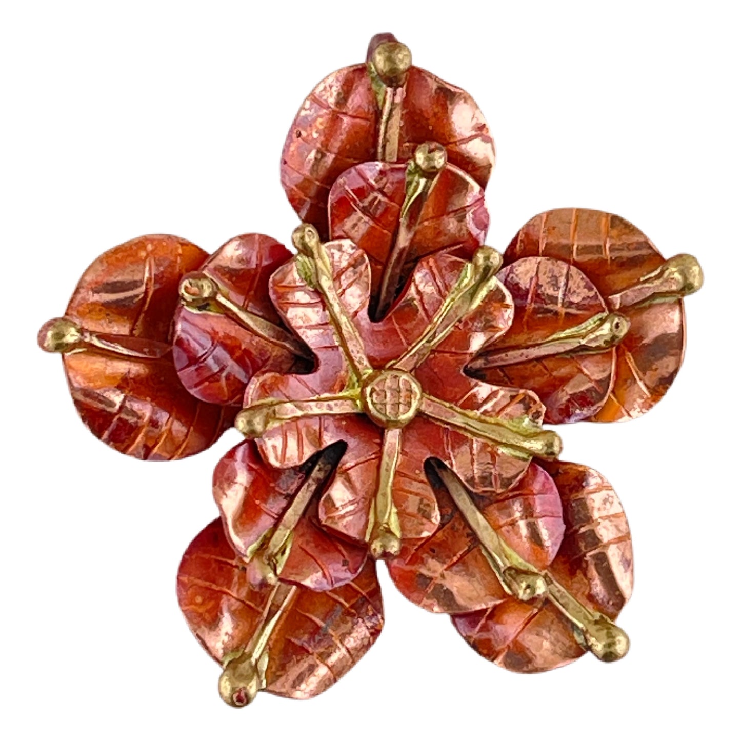 Handmade copper and brass rose pendant with three repoussé layers, hand-stamped texture, and torch-fired patina by Patricia Healey