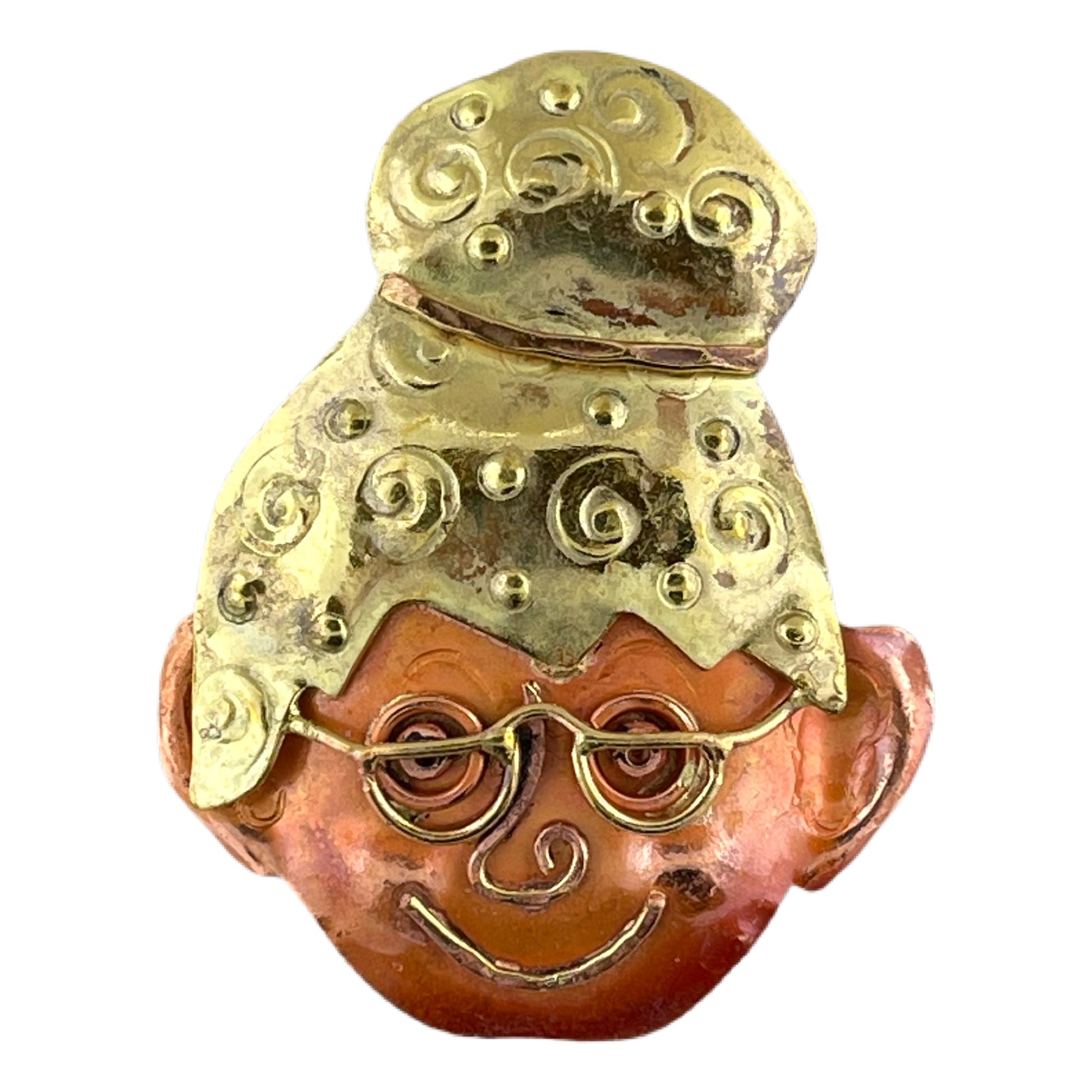 Handmade copper and brass grandma pendant with glasses, stamped bun, and warm smile by Patricia Healey