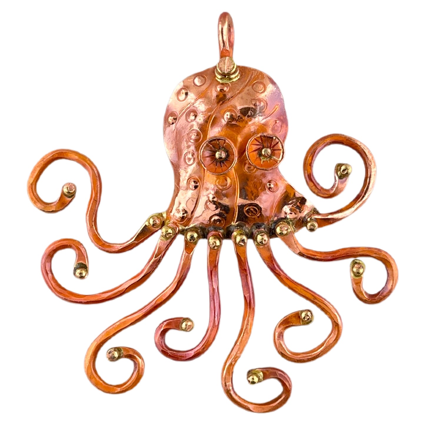 Artisan copper octopus pendant with swirling arms, repoussé texture, red flame patina, and brass detailing by Patricia Healey