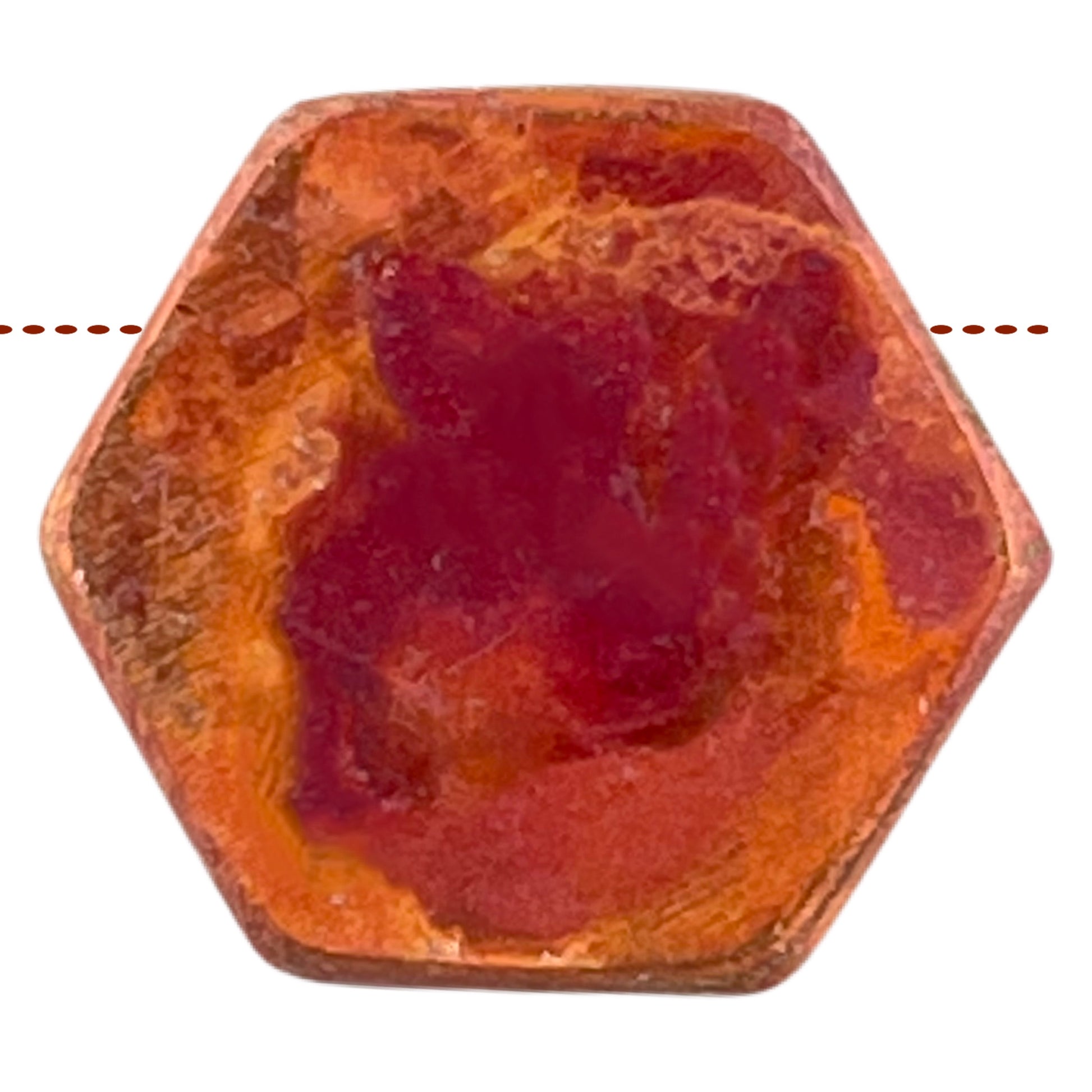 Small handcrafted hexagon copper bead with hammered texture and red-orange flame patina
