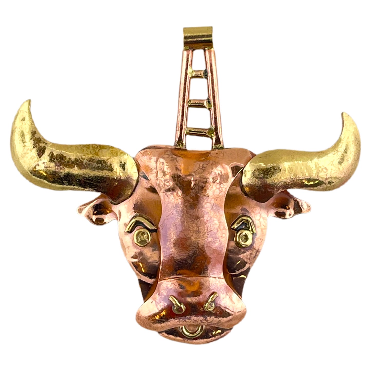 Handcrafted copper bull pendant with brass horns and red flame patina, sculpted and stamped by Patricia Healey for zodiac and bold jewelry designs