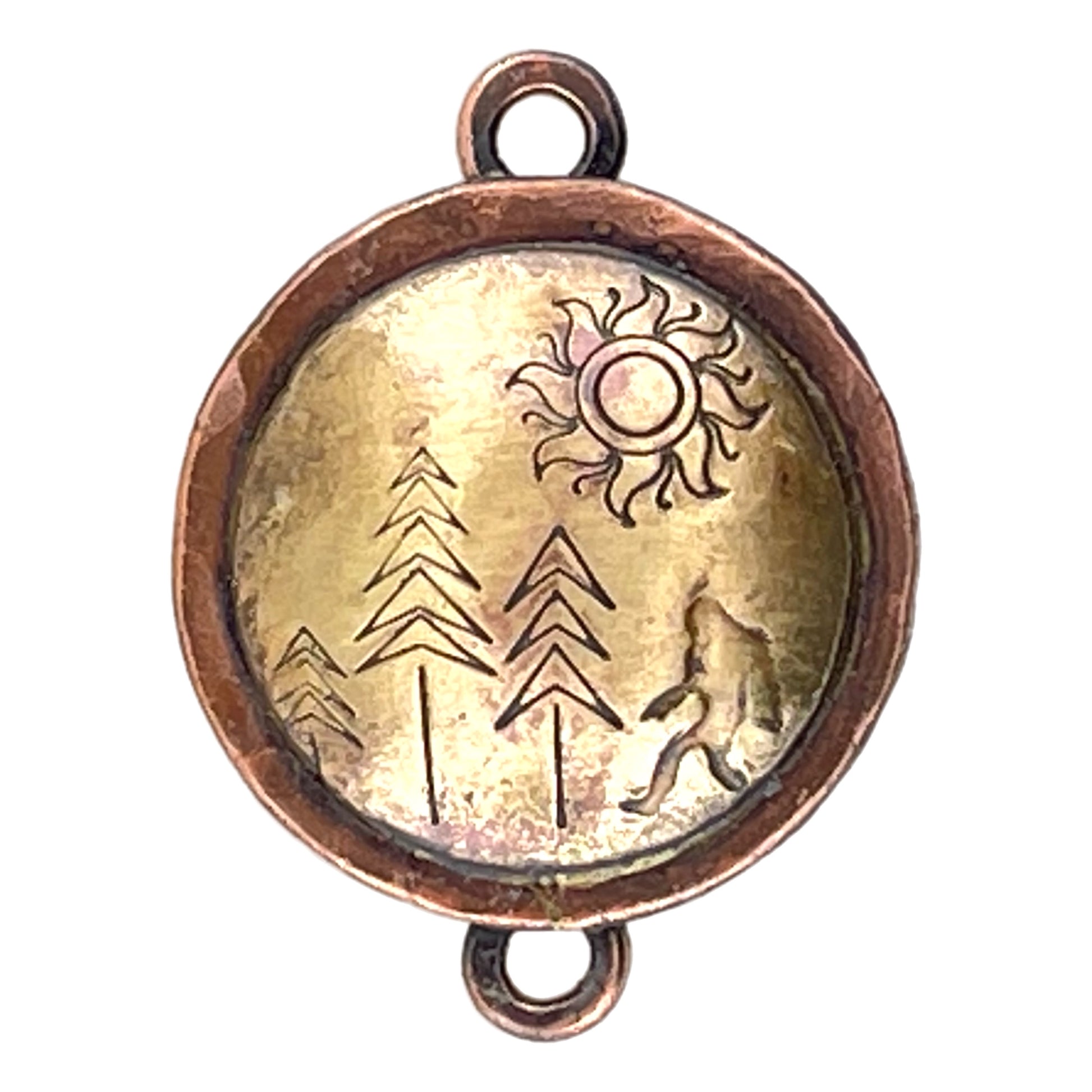 Handcrafted copper and brass pendant link featuring Bigfoot silhouette among pine trees