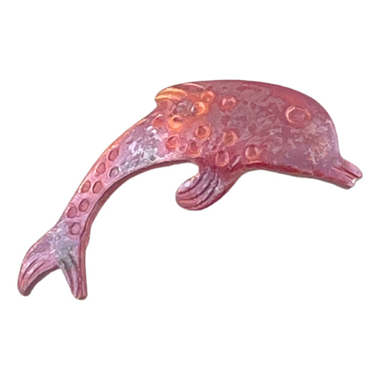 Left-facing copper dolphin charm with torch-fired red and orange patina, hand-stamped texture
