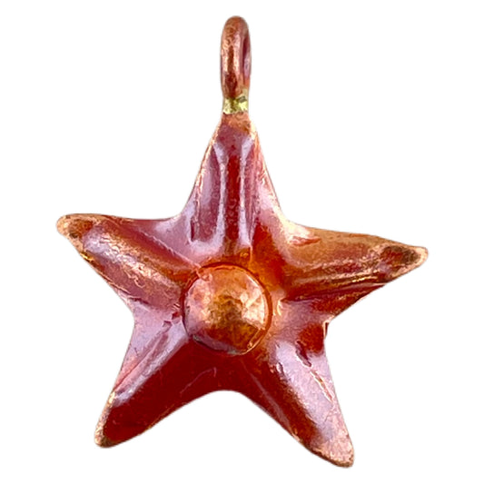 Handmade small copper star charm with repoussé detail and torch-fired red-orange patina by Patricia Healey