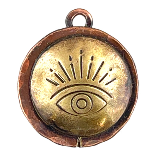 Antiqued copper and brass evil eye charm with hand-stamped design and copper accents