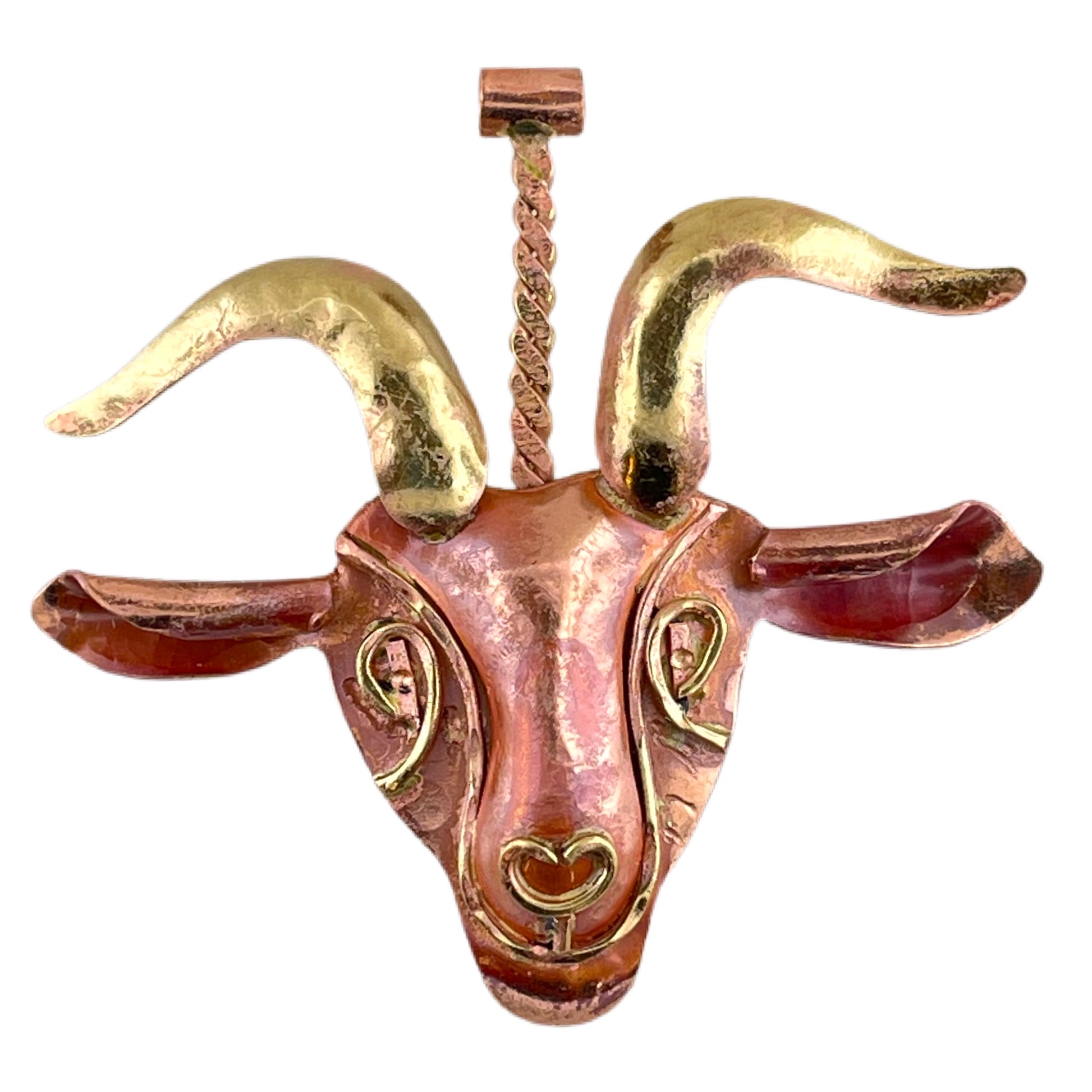 Handcrafted copper goat pendant with brass detail and red patina, featuring expressive stamping and rustic charm by Patricia Healey