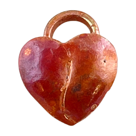 Small copper and brass heart charm with hammered surface and rich patina