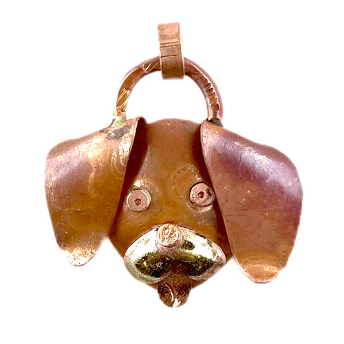 Handcrafted copper puppy pendant with brass snout and red flame patina, designed by Patricia Healey for dog lovers and artistic jewelry