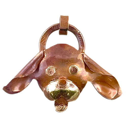Handcrafted “I’m All Ears” copper puppy pendant with brass detail and red flame patina, designed by Patricia Healey for dog lovers and artisan jewelry
