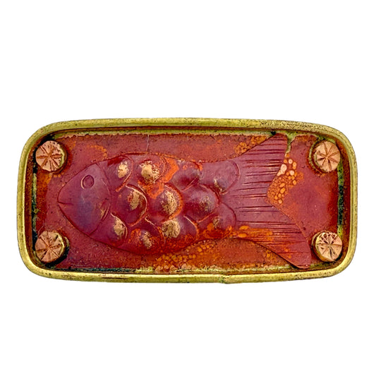 Rectangular copper and brass slider bar with raised fish design and red patina for 10mm flat leather bracelet