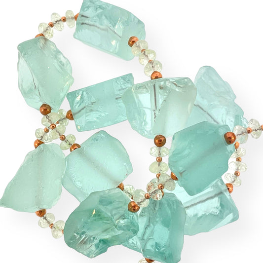 16 1/2 inch strand of large seafoam aqua quartz beads paired with neutral quartz and copper spacer