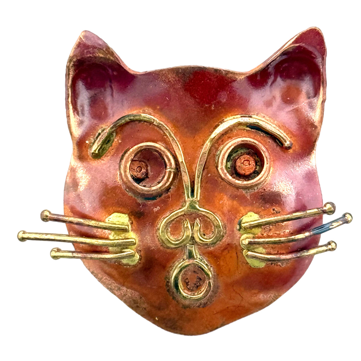 Whimsical copper and brass cat face slider with raised detailing and red patina for 10mm flat leather bracelet