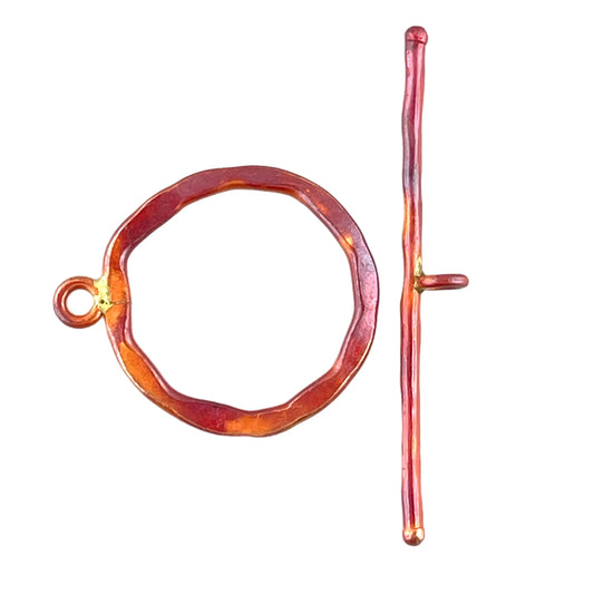 Large handmade copper toggle clasp with red patina and classic hammered texture