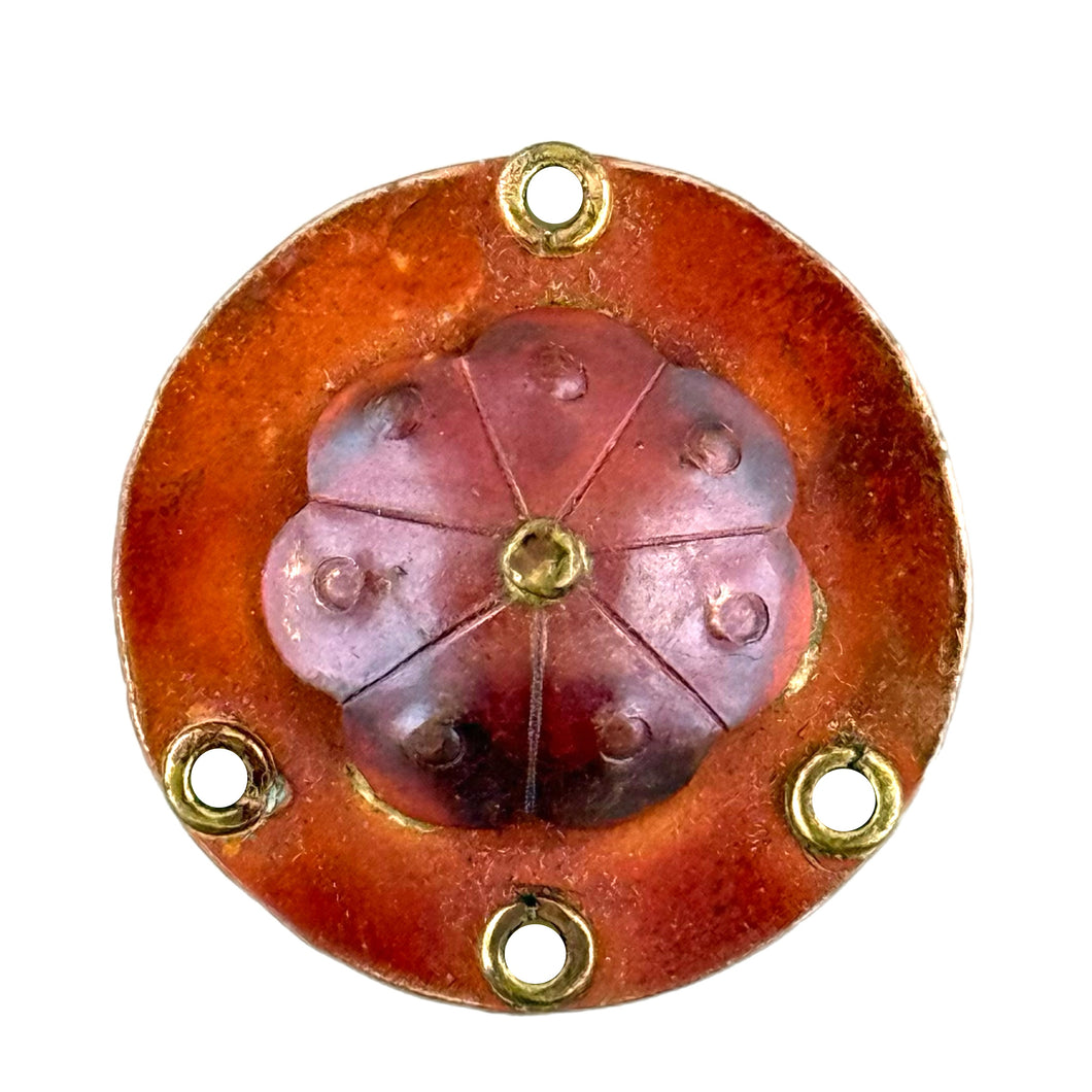 Handmade copper floral connector with domed shape, stamped texture, 4 drill holes, and brass accents by Patricia Healey