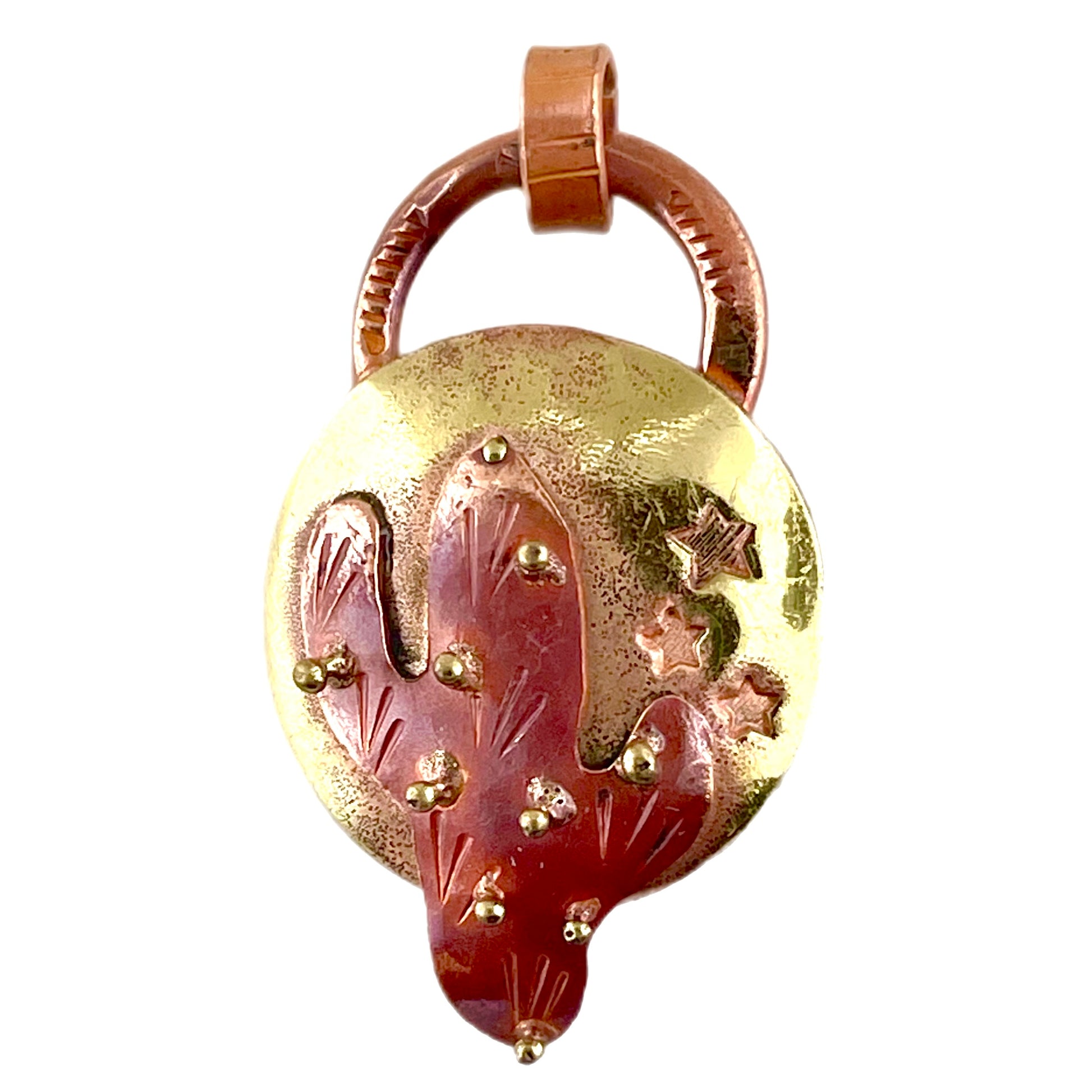 Close-up of handcrafted copper and brass saguaro cactus pendant with rustic flame finish
