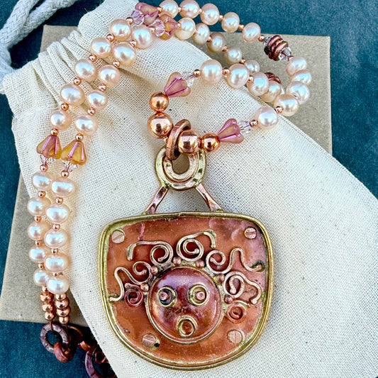 Cultured pearl necklace with copper and brass truth face pendant, Czech glass and Swarovski crystal beads