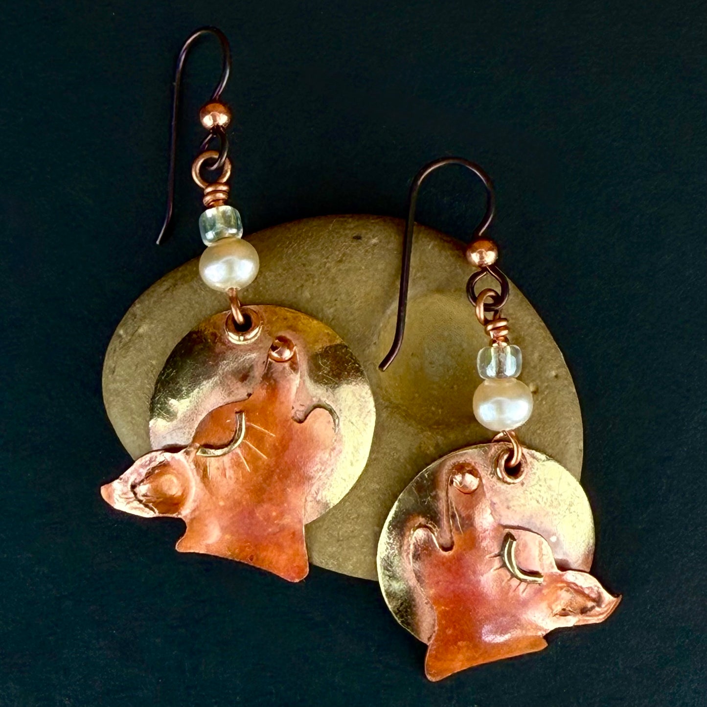 Handcrafted copper and brass coyote earrings with cultured pearls and green dichroic beads on niobium ear wires