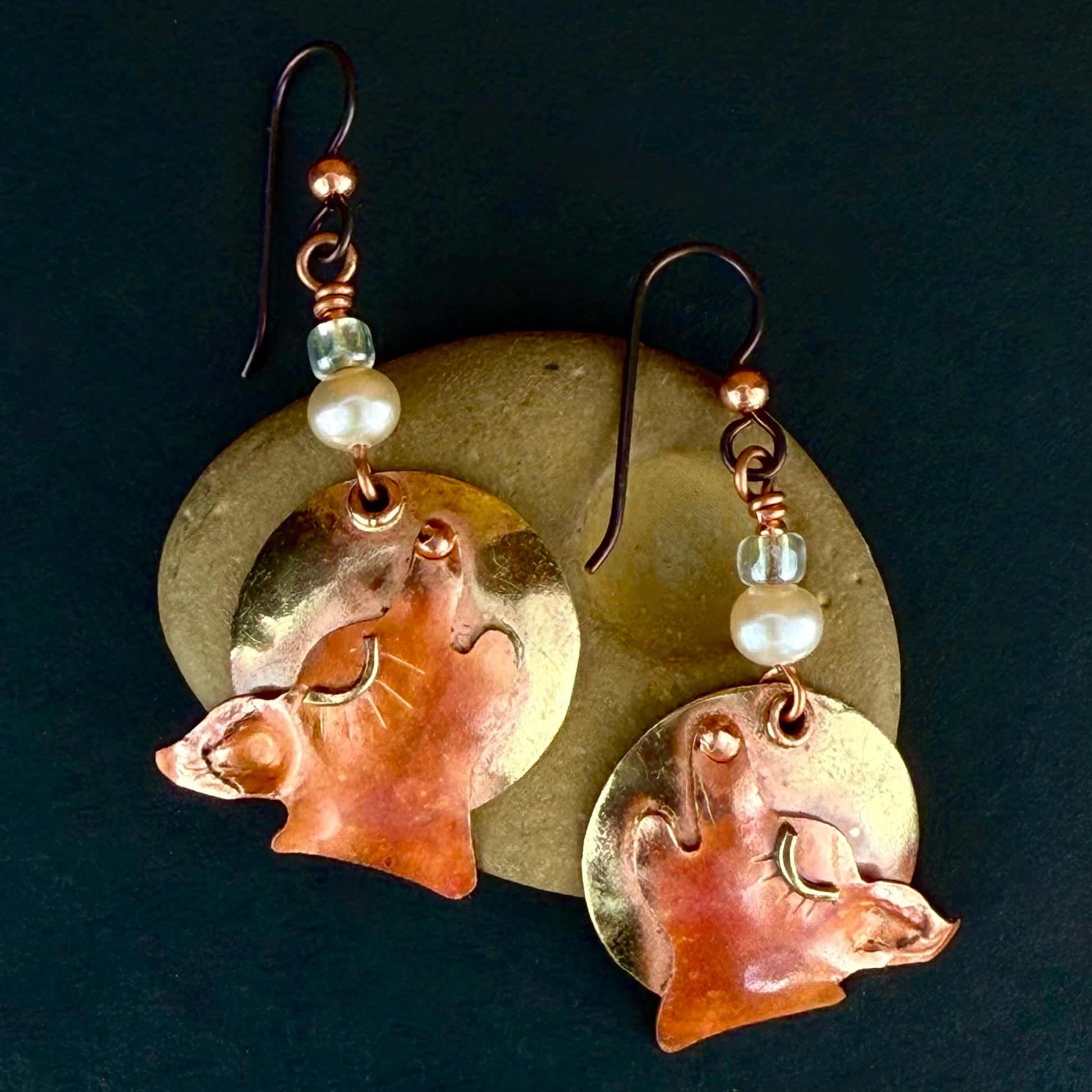 Handcrafted copper and brass coyote earrings with cultured pearls and green dichroic beads on niobium ear wires