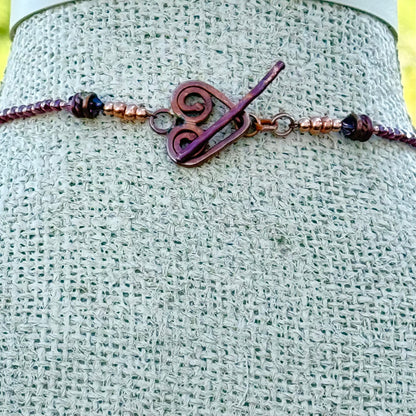 Octopus Necklace in Flame-Finished Copper with Purple Dichroic Beads