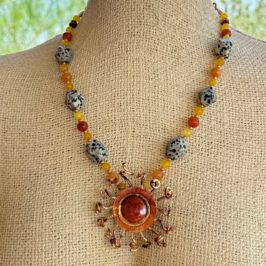 handcrafted copper and brass sunburst necklace with yellow jade, carnelian, and Dalmatian jasper stones
