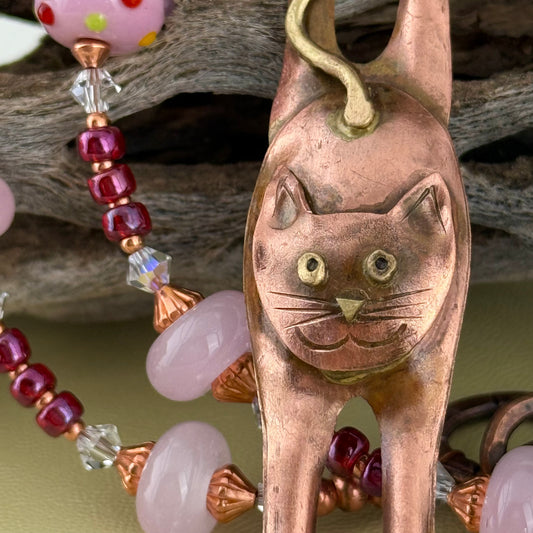 Handcrafted copper cat necklace with pink glass beads, Swarovski crystal, and seed beads by Patricia Healey