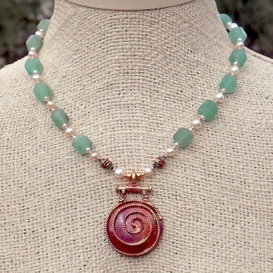 Handmade copper spiral pendant necklace with African tourmaline beads, cultured pearls, and brass accents 