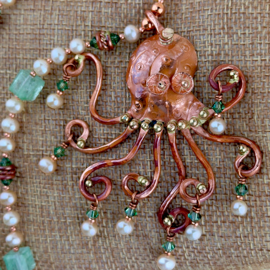 Handmade copper octopus pendant necklace with aquamarine quartz, cultured pearls, Swarovski crystals, and nautical shell toggle clasp