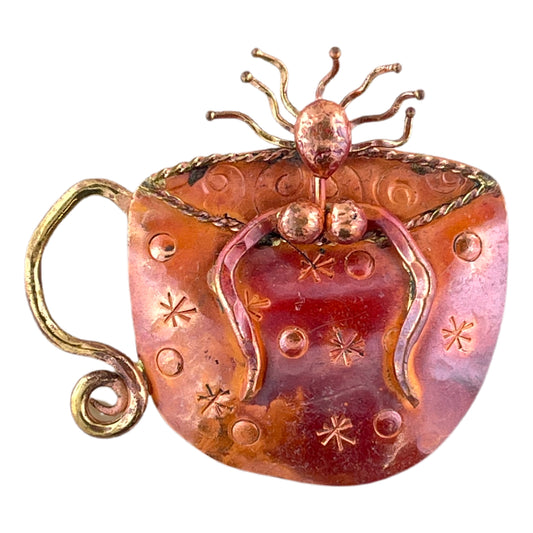 Copper pendant with wild-haired woman lounging in a coffee cup, whimsical and handmade by Patricia Healey