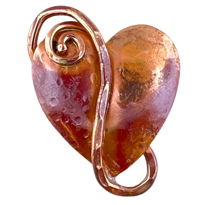 Copper heart pendant with pounded wire detail and soft spiral, flame-fired red patina, handcrafted by Patricia Healey using repoussé technique.