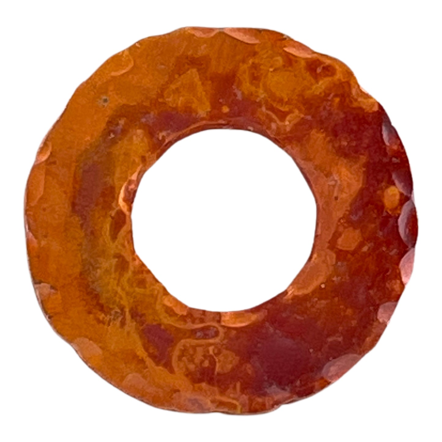 Small handcrafted copper ring with hammered texture and torch-fired red patina, symmetrical design for jewelry making