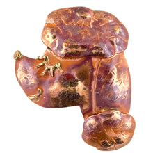 Handcrafted poodle pendant in copper with brass face detail and red flame patina, designed by Patricia Healey for dog lovers and artistic jewelry