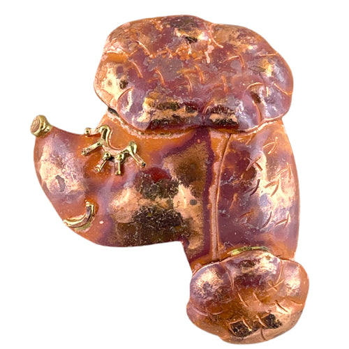 Handcrafted poodle pendant in copper with brass face detail and red flame patina, designed by Patricia Healey for dog lovers and artistic jewelry