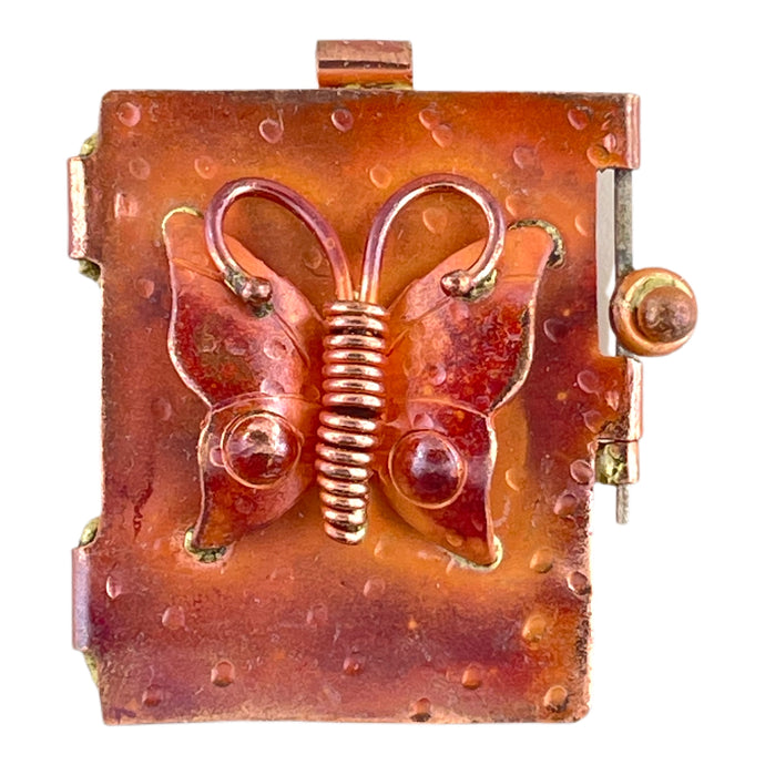 Handcrafted butterfly locket in copper and brass with red patina and swing-open door