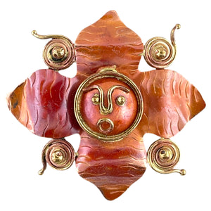 Handmade copper flower pendant with brass face and spiral details, created by Patricia Healey
