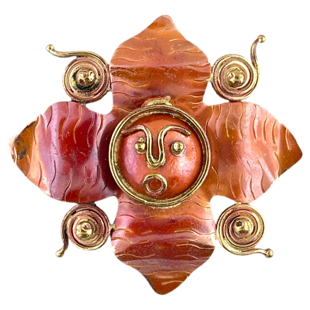 Handmade copper flower pendant with brass face and spiral details, created by Patricia Healey
