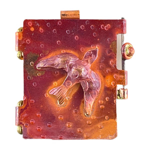 Handcrafted copper dove locket with swing-open door, rustic red patina, and brass accents