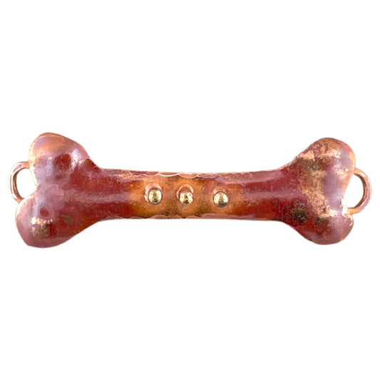 Handcrafted copper bone link with three brass dots and red flame patina, designed by Patricia Healey for dog-themed jewelry making