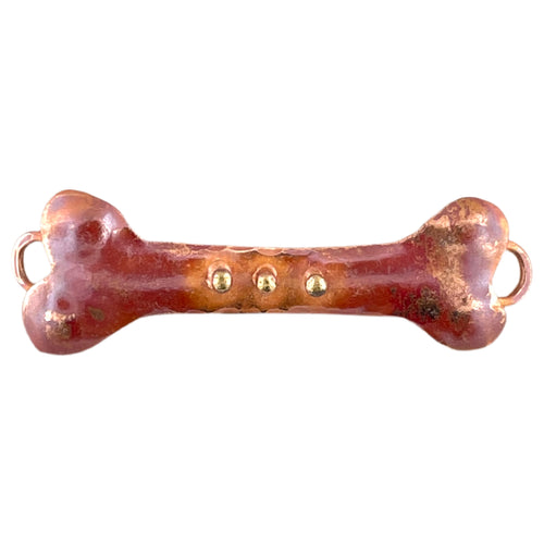 Handcrafted copper bone link with three brass dots and red flame patina, designed by Patricia Healey for dog-themed jewelry making