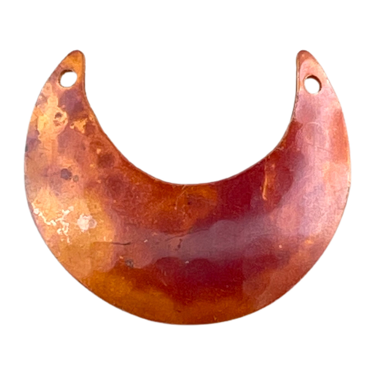 Small handmade copper crescent moon pendant with hammered texture, flame-torched red and orange tones, drilled for jewelry design