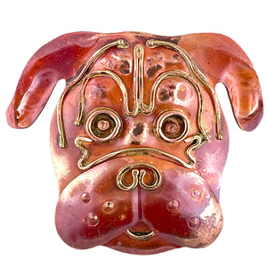 Copper and brass dog pendant with short snout, red flame patina, and hand-stamped detail